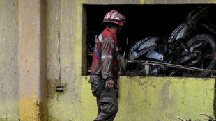 Neighbors, rescuers search for missing after Venezuela landslide