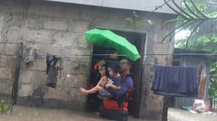 Philippines floods force tens of thousands to flee homes