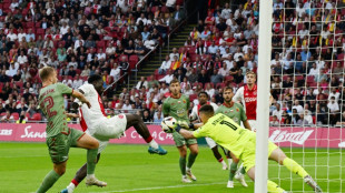 Ajax advance in style but Chelsea made to sweat