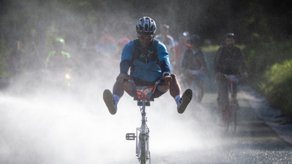 Slovenians race to celebrate legendary fold-up bike 