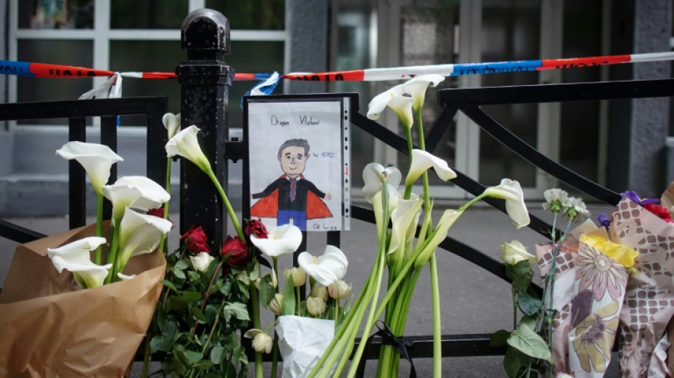 'Our hero': tributes to security guard killed in Belgrade shooting
