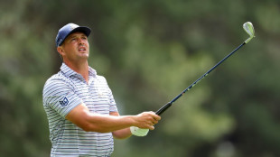 DeChambeau leads Scheffler by one at Masters as ill winds swirl