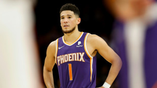 Booker stars as Suns beat Heat to seal NBA playoff berth