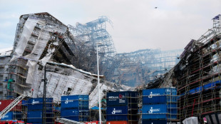 Historic Copenhagen building smolders for third day as facade collapses