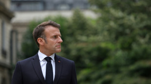 France celebrates national day as political crisis rumbles on