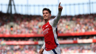 Arsenal sink Wolves in flying start to title charge