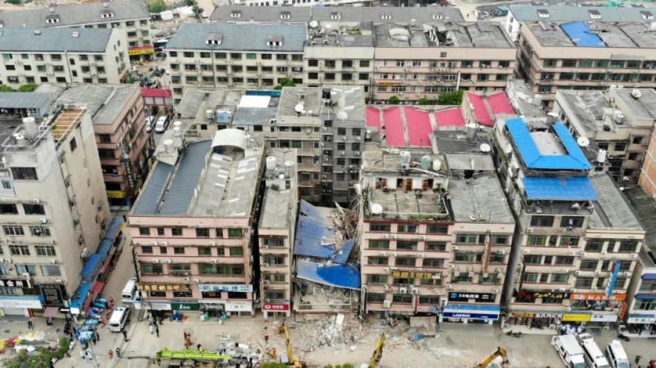 Dozens trapped in China building collapse