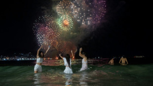 Fireworks, weapons light up skies as world enters 2024