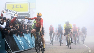 Dane Cort Nielsen beats Roglic in the fog to take Dauphine lead