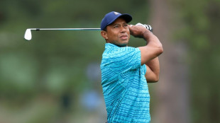 Tiger battles back to stay in chase at the Masters 