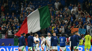 Italy down after Spain humbling, but not out