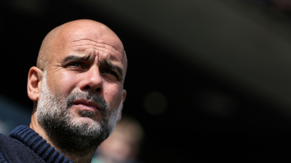 Guardiola urges Man City to seize chance to make Premier League history