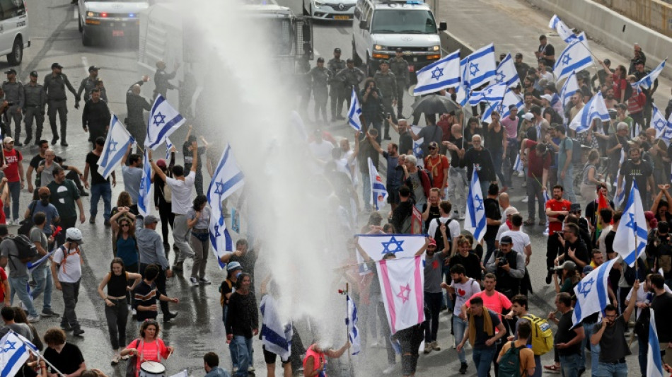 Israel's Netanyahu vows unity as thousands decry justice reforms